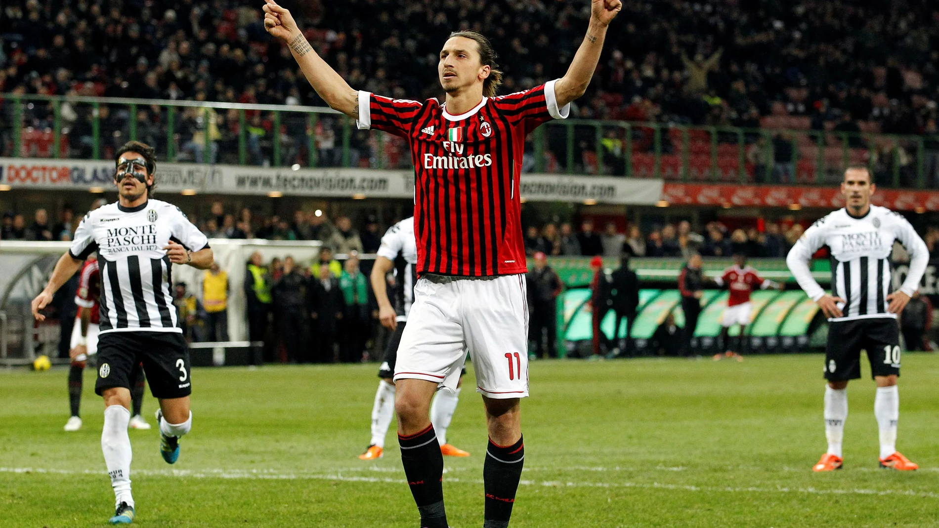 FILE PHOTO: AC Milan's Zlatan Ibrahimovic celebrates after scoring a goal against Siena during their Italian Serie A soccer match in Milan