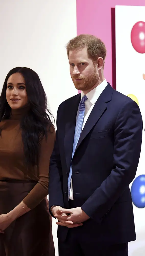 Britain's Prince Harry and Meghan, Duchess of Sussex look at an art exhibition by Indigenous Canadian artist Skawennati in the Canada Gallery, during their visit to Canada House to meet with Canada's High Commissioner to the UK, Janice Charette, as well as staff to thank them for the warm hospitality and support they received during their recent stay in Canada, in London, Tuesday, Jan. 7, 2020. (Daniel Leal-Olivas/Pool Photo via AP)