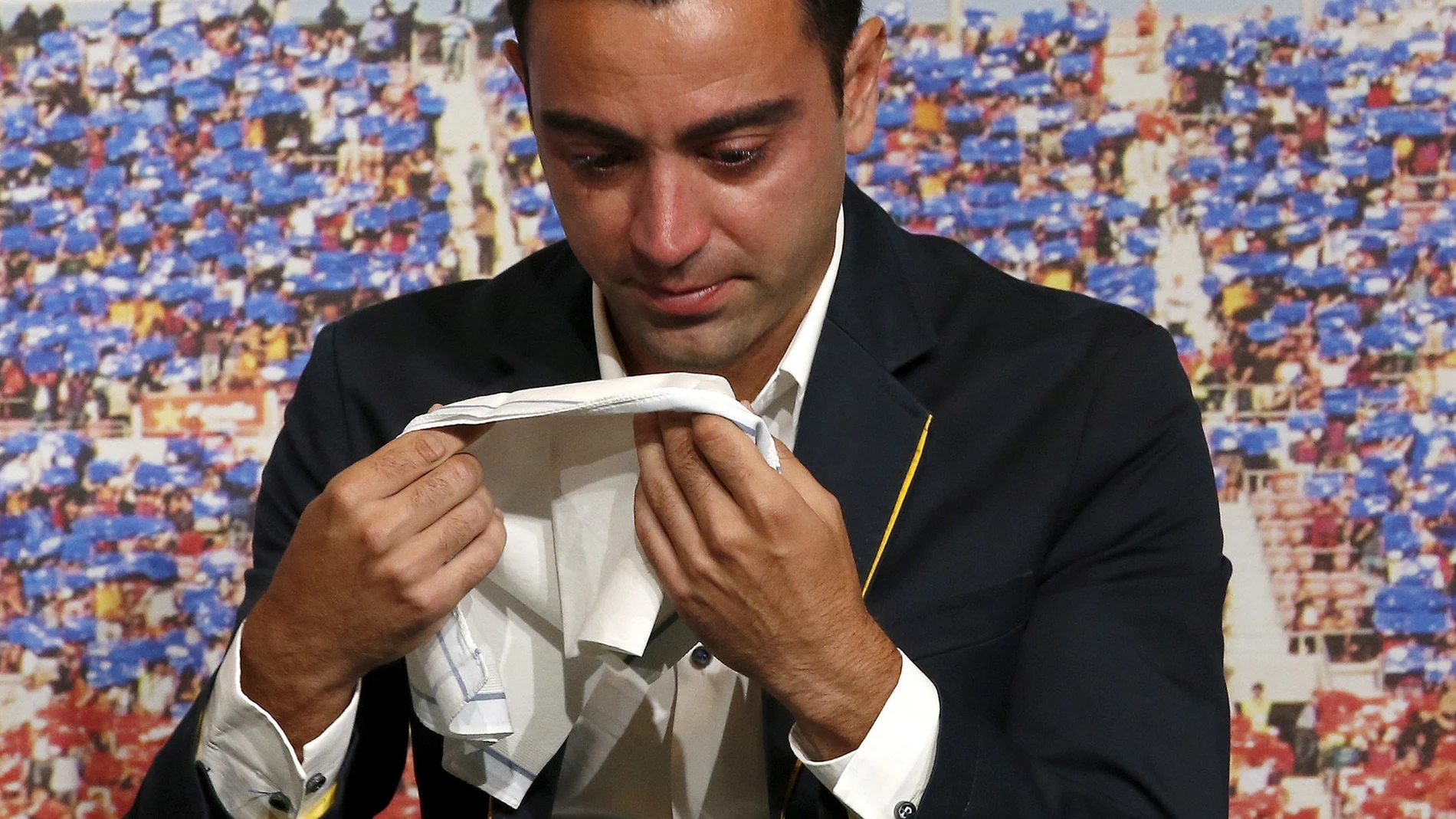 FILE PHOTO: Barcelona's Xavi Hernandez cries during his farewell event at Auditori 1899 in Nou Camp stadium in Barcelona