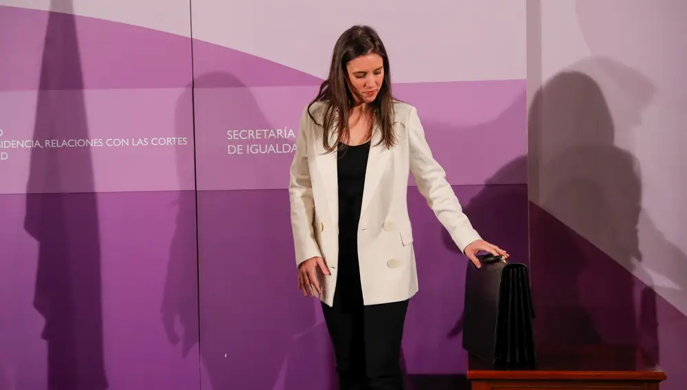 Spain's new Minister for Equality Irene Montero holds her portfolio, after it was handed over to her, in Madrid