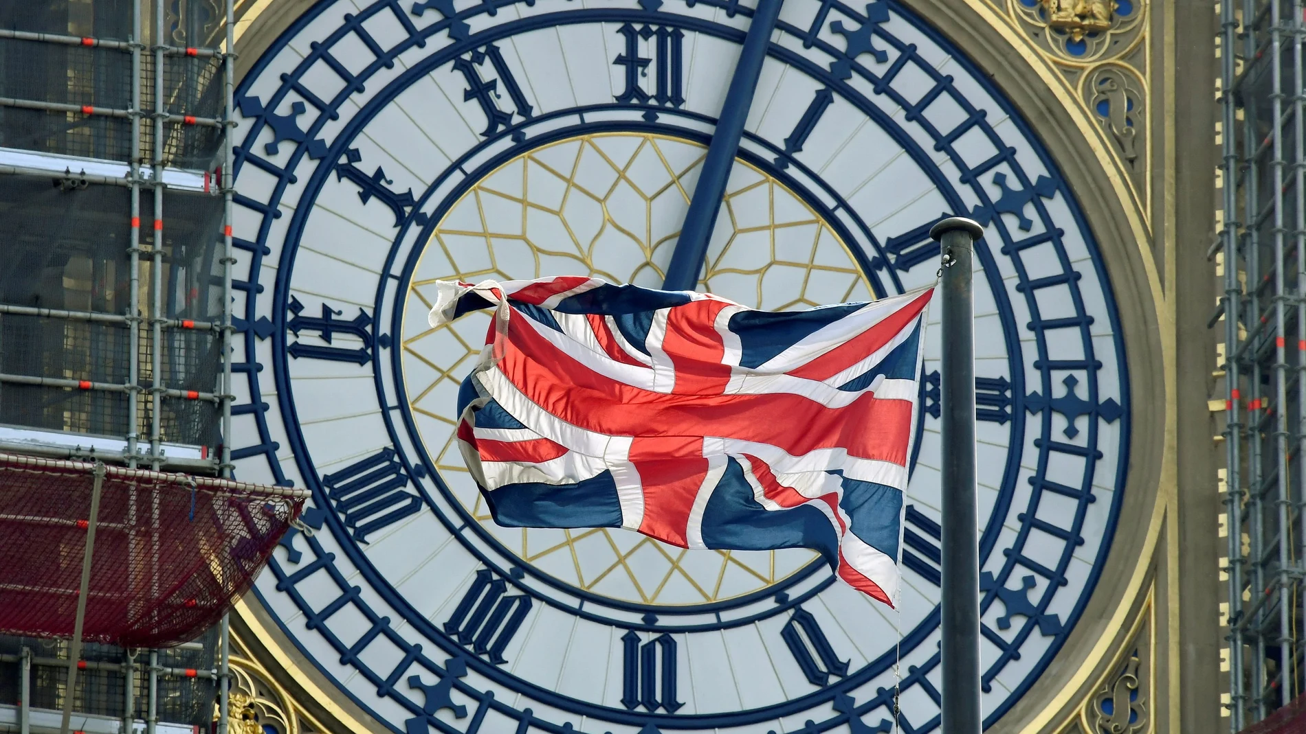 FILE PHOTO: British Union Jack flag flies in front of the clock face of Big Ben in London