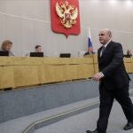 In this handout photo provided by The State Duma, The Federal Assembly of The Russian Federation, Russian Tax Service chief Mikhail Mishustin, who was nominated to replace Medvedev, leaves a podium after his speech at the State Duma, the Lower House of the Russian Parliament in Moscow, Russia, Thursday, Jan. 16, 2020. 53-year-old Mishustin, the longtime chief of Russia's tax service, was tapped for the post by President Vladimir Putin. The lower house of Russia's parliament, the Duma, quickly appointed Mishustin as prime minister on Thursday. (The State Duma, The Federal Assembly of The Russian Federation via AP)