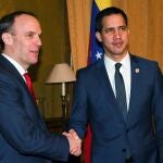 Venezuela's opposition leader Juan Guaido, shakes hands with British Foreign Secretary Dominic Raab at Foreign Office in London, Britain January 21, 2020.
