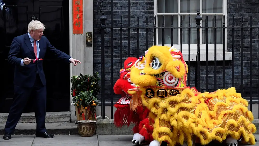 British Prime Minister Boris Johnson gestures as he watches a performance during celebrations for Chinese Lunar New Year at Downing Street in London, Britain January 24, 2020. REUTERS/Toby Melville