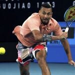 Australia's Nick Kyrgios runs to make a backhand return to Russia's Karen Khachanov during their third round singles match at the Australian Open tennis championship in Melbourne, Australia, Saturday, Jan. 25, 2020. (AP Photo/Lee Jin-man)