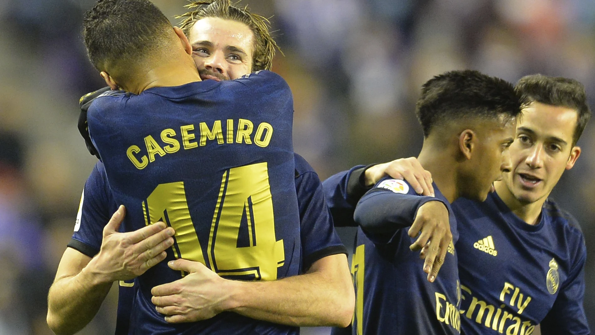 Real Madrid's Nacho, 2nd left, celebrates with Casemiro after scoring his side's opening goal during a Spanish La Liga soccer match between Valladolid and Real Madrid at the Jose Zorrilla stadium in Valladolid, Spain, Sunday Jan. 26, 2020. (AP Photo/Ricardo Ordonez)