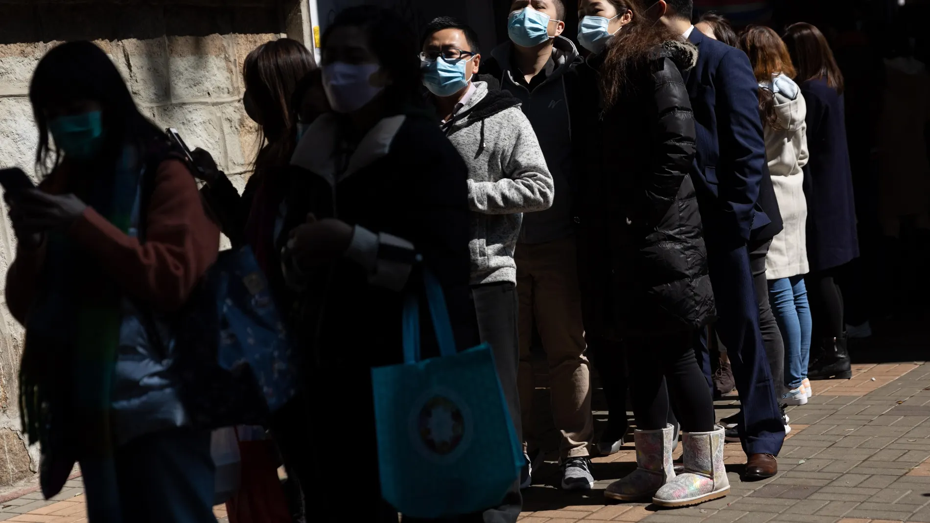 Long queues outside pharmacies as coronavirus fear spreads in Hong Kong