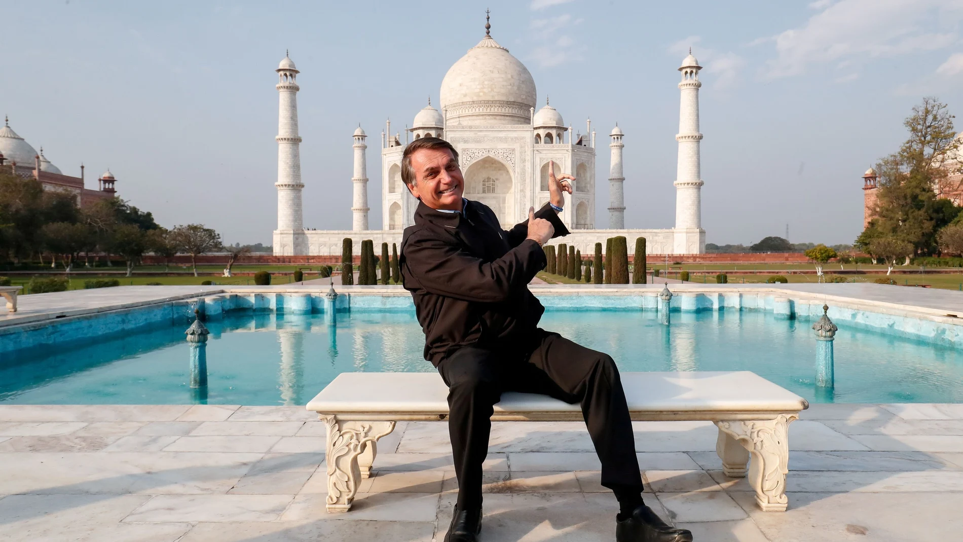 Brazil's President Jair Bolsonaro poses for a photograph at the Taj Mahal in Agra