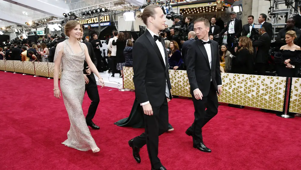 Eliza Rycembel, Bartosz Bielenia and Jan Komasa walk on the red carpet during the Oscars arrivals at the 92nd Academy Awards in Hollywood, Los Angeles, California, U.S., February 9, 2020. REUTERS/Mike Blake