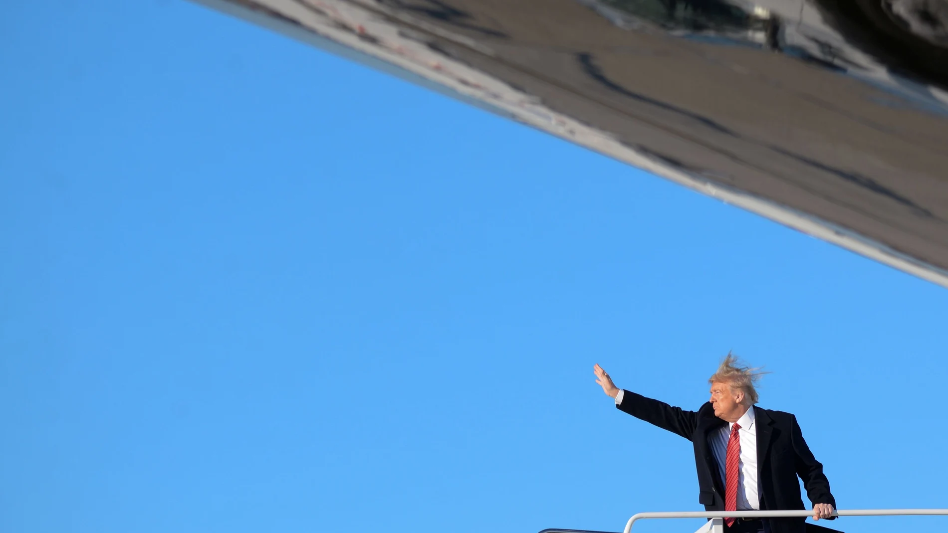U.S. President Donald Trump boards Air Force One as they depart Washington for travel to Florida