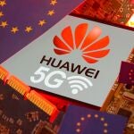 FILE PHOTO: The EU flag and a smartphone with the Huawei and 5G network logo are seen on a PC motherboard in this illustration taken January 29, 2020. REUTERS/Dado Ruvic/Illustration/File Photo