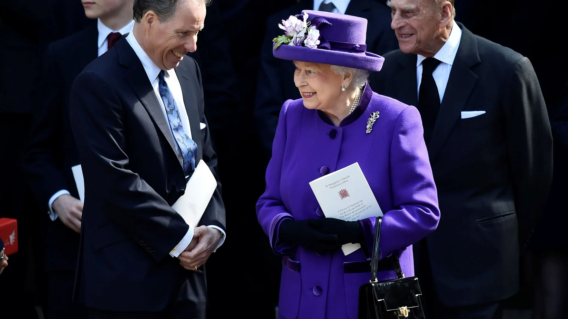 FILE PHOTO: David Armstrong-Jones speak to Britain's Queen Elizabeth and Prince Philip as they leave a Service of Thanksgiving for the life and work of Lord Snowdon at Westminster Abbey in London