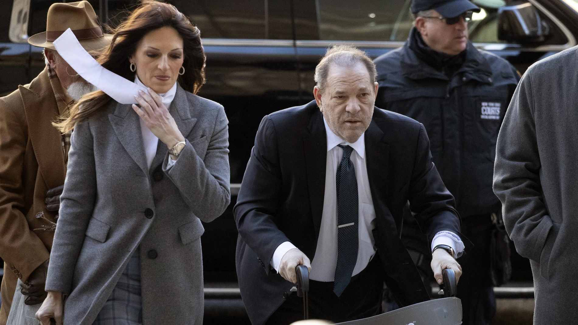 Harvey Weinstein arrives at a Manhattan court with his defense attorney Donna Rotunno, left, as jury deliberations continue in his rape trial, Friday, Feb. 21, 2020 in New York. (AP Photo/Mark Lennihan)