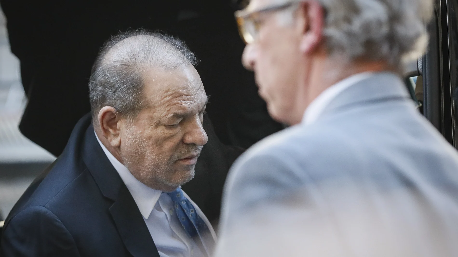 Harvey Weinstein arrives at a Manhattan courthouse for his rape trial, Monday, Feb. 24, 2020, in New York. A jury convicted the Hollywood mogul of rape and sexual assault. The jury found him not guilty of the most serious charge, predatory sexual assault, which could have resulted in a life sentence. (AP Photo/John Minchillo)