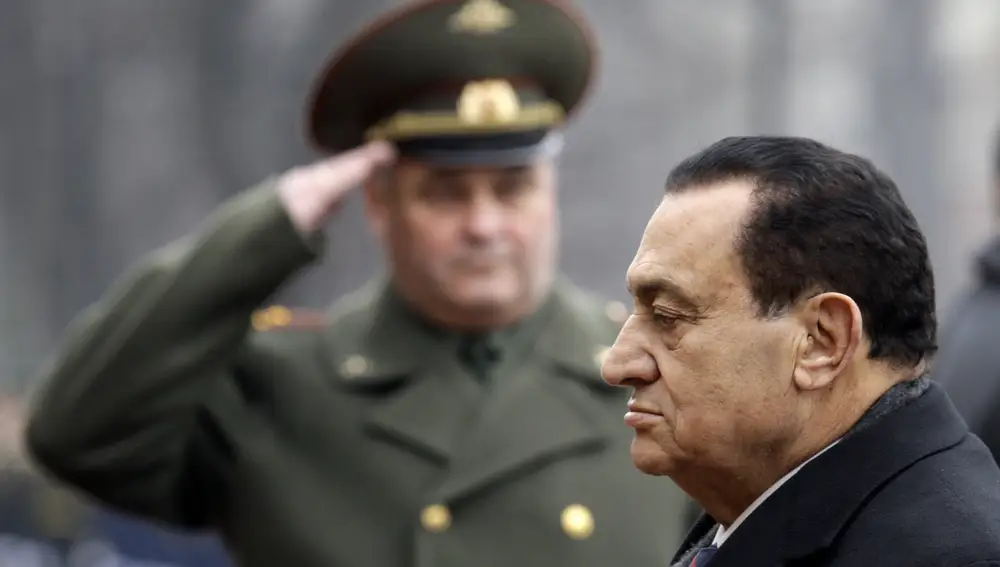 FILE - In this March 25, 2008 file photo, Egypt's President Hosni Mubarak looks attends a wreath laying ceremony at the Tomb of the Unknown Soldier outside Moscow's Kremlin wall. Egypt's state TV said Tuesday, Feb. 25, 2020, that the country's former President Hosni Mubarak, ousted in the 2011 Arab Spring uprising, has died at 91. Mubarak, who was in power for almost three decades, was forced to resign on Feb. 11, 2011, after following 18 days of protests around the country. The Arab Spring uprisings had convulsed autocratic regimes across the Middle East. (AP Photo/Misha Japaridze, File)