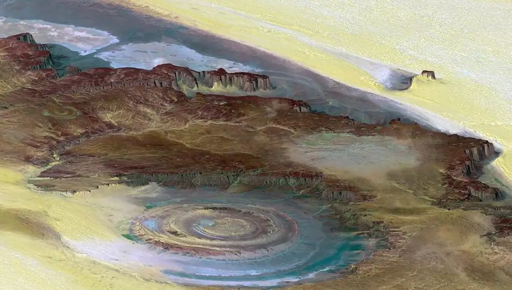 Fotografía aérea del ojo de África donde los colores se han alterado para mostrar su composición incluyendo infrarrojos.Marrón (rocas), amarillo (arena), verde (vegetación), blanco (sales).Nadie dijo que la NASA fuera creativa con los colores.