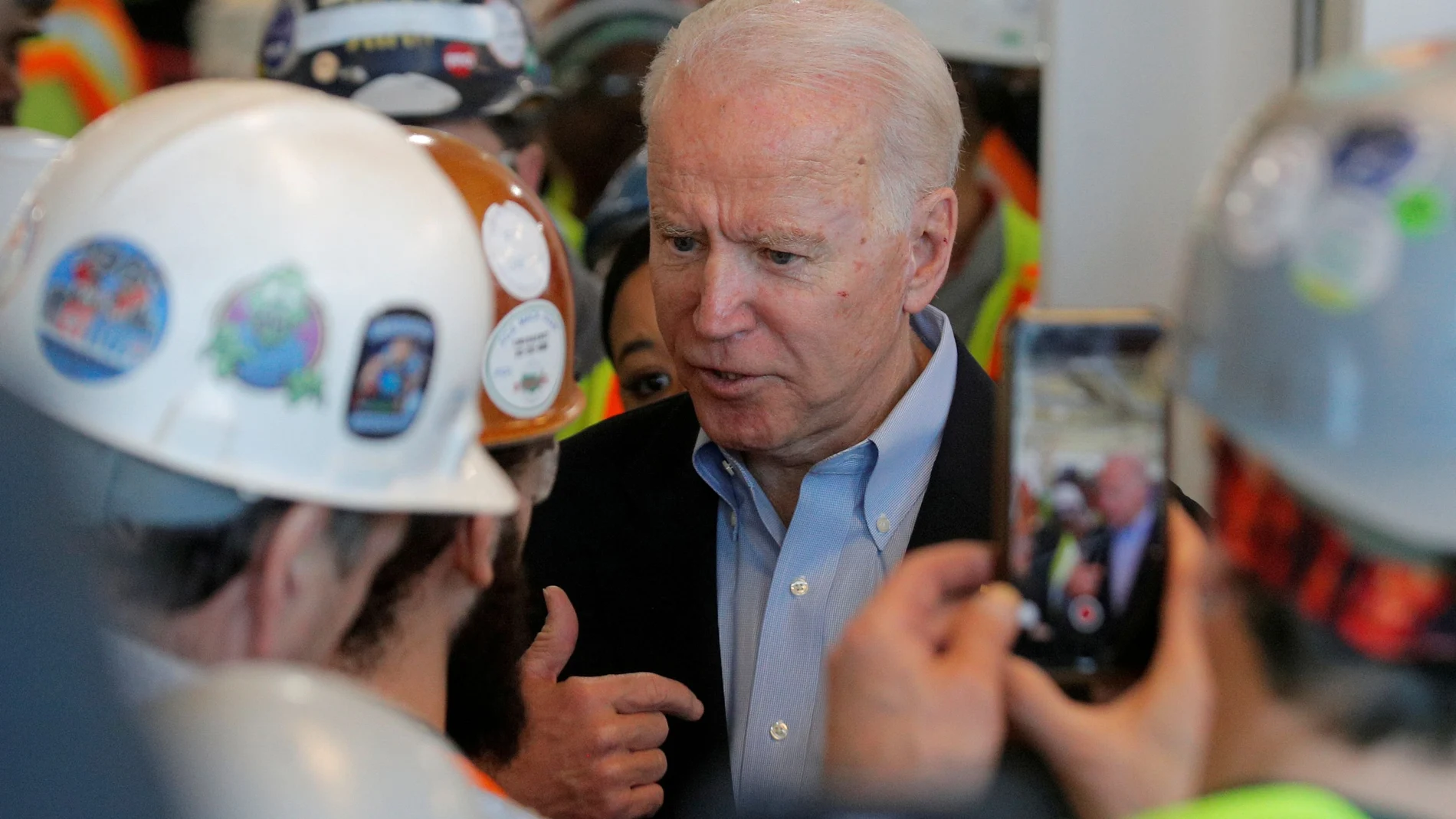 Democratic U.S. presidential candidate and former Vice President Joe Biden argues with a worker about his positions on gun control during a campaign stop at a plant in Detroit, Michigan