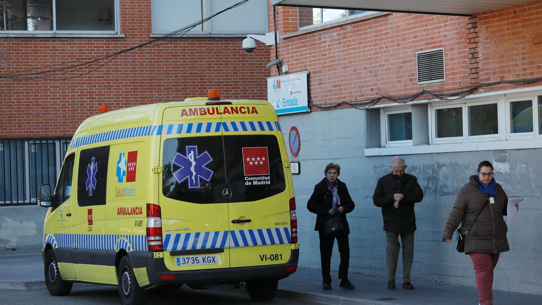 FILE PHOTO: People leave Hospital Carlos III after a case of coronavirus was confirmed, in Madrid, Spain