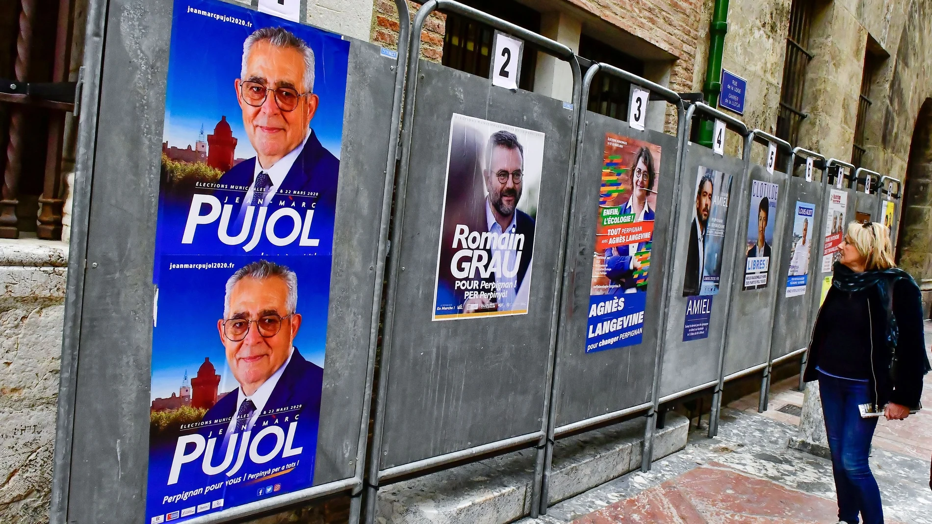 Campaign posters of Jean-Marc Pujol, Mayor of Perpignan, are seen in front of the city hall in Perpignan