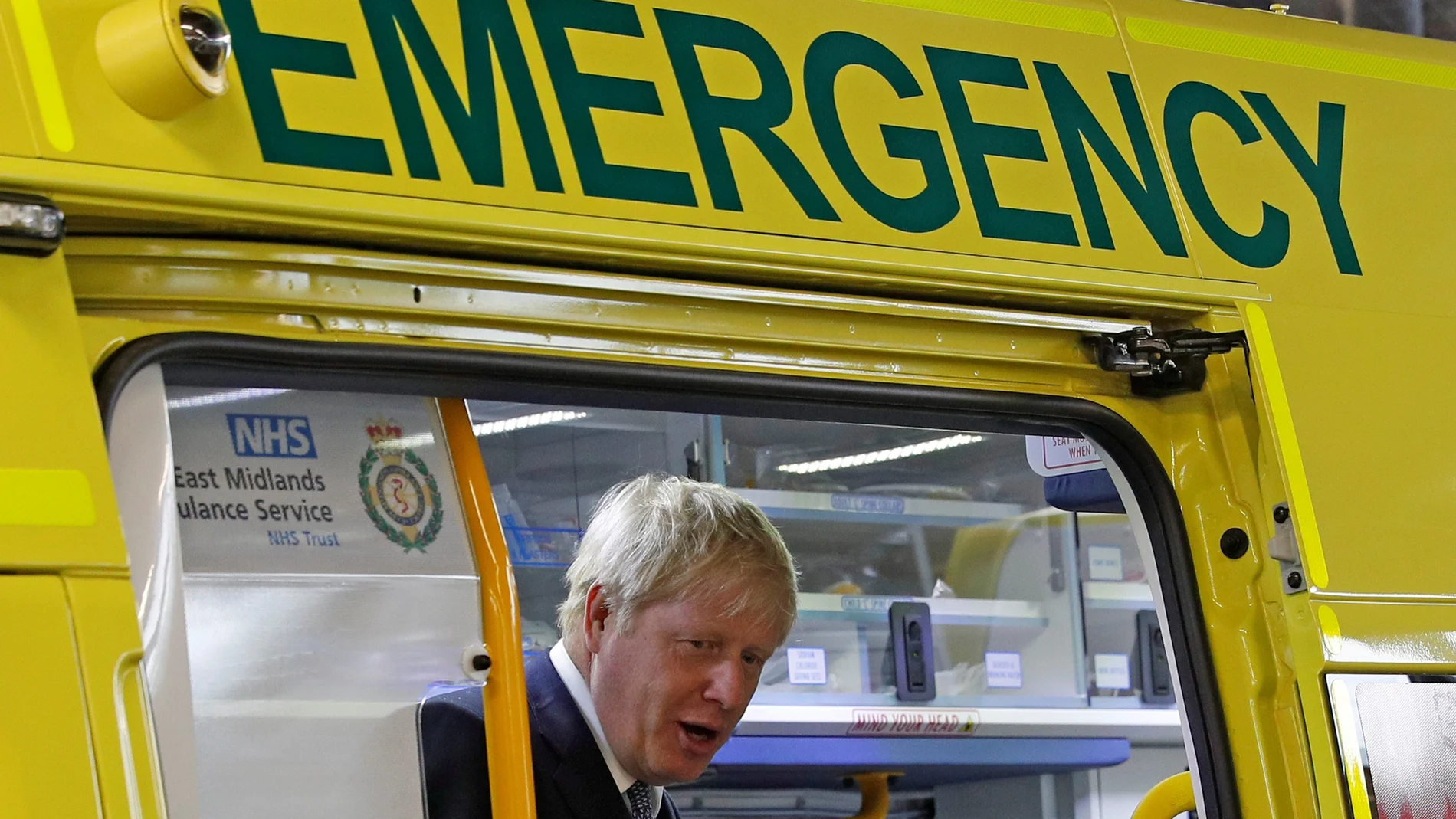 FILE PHOTO: Britain's Prime Minister Boris Johnson looks out from an ambulance during a visit to Pilgrim Hospital in Boston, Britain August 5, 2019.