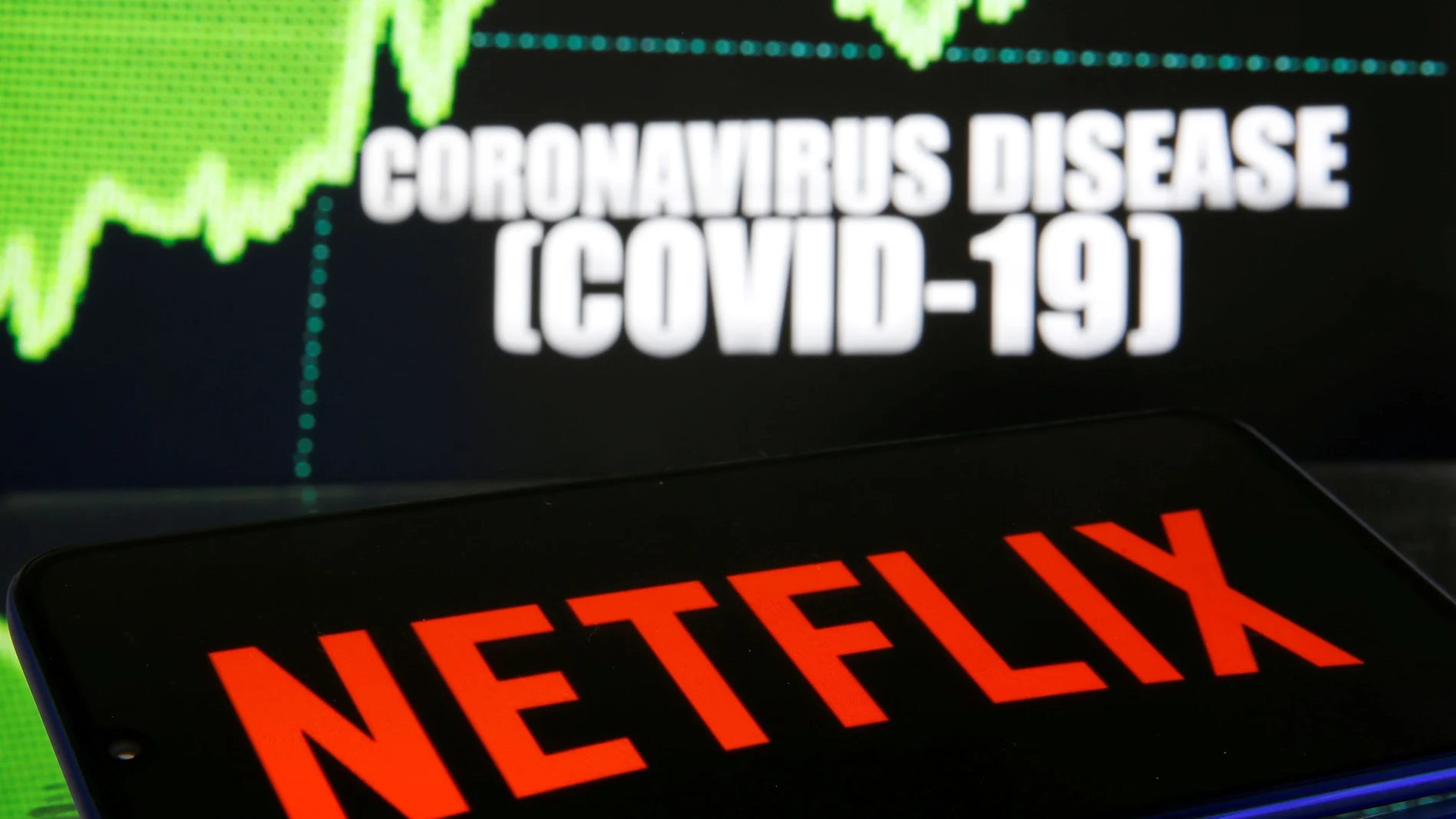 FILE PHOTO: Netlix logo is seen in front of diplayed coronavirus disease (COVID-19)