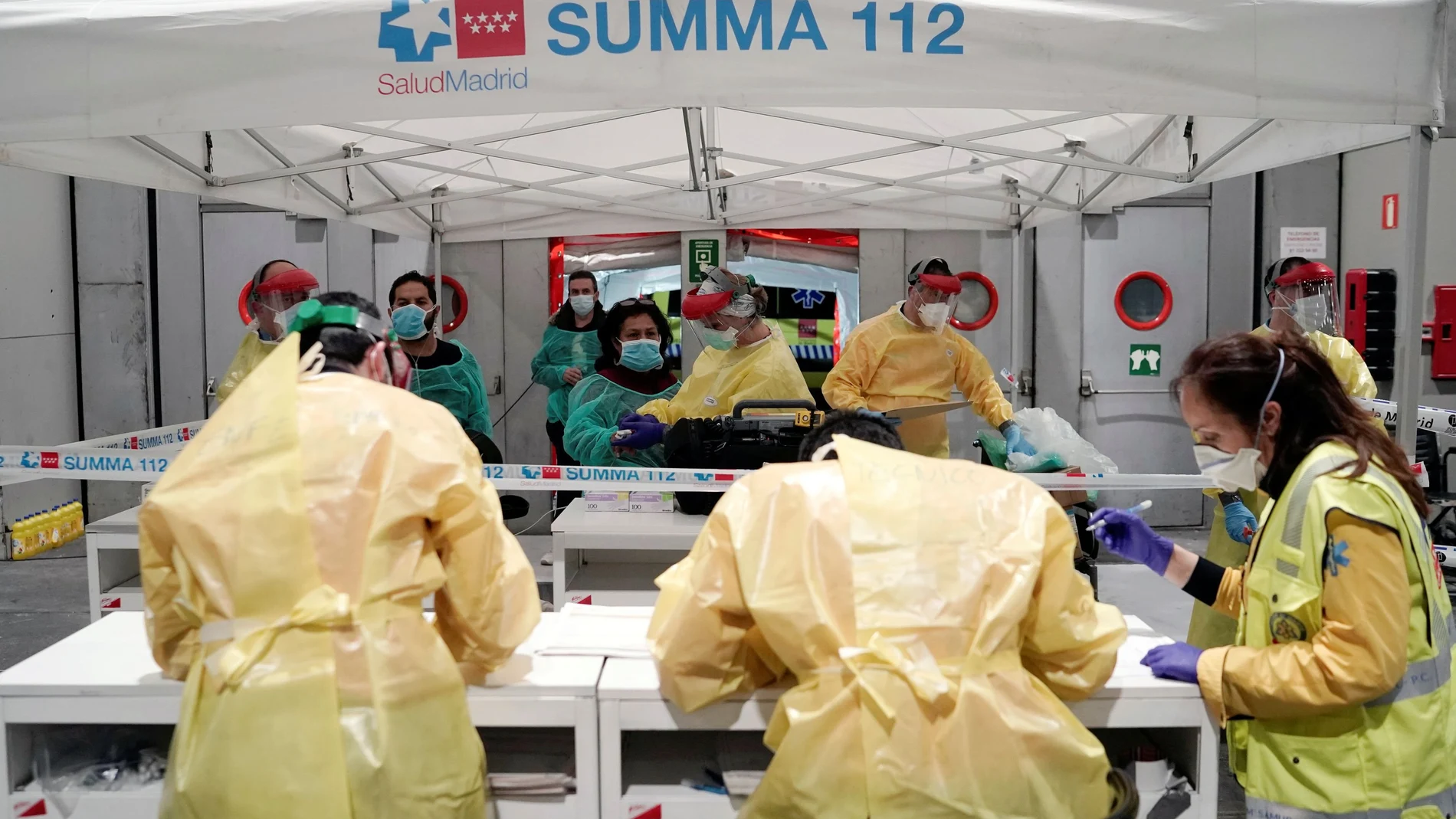 Coronavirus patients arrive at a military hospital set up at the IFEMA conference centre in Madrid