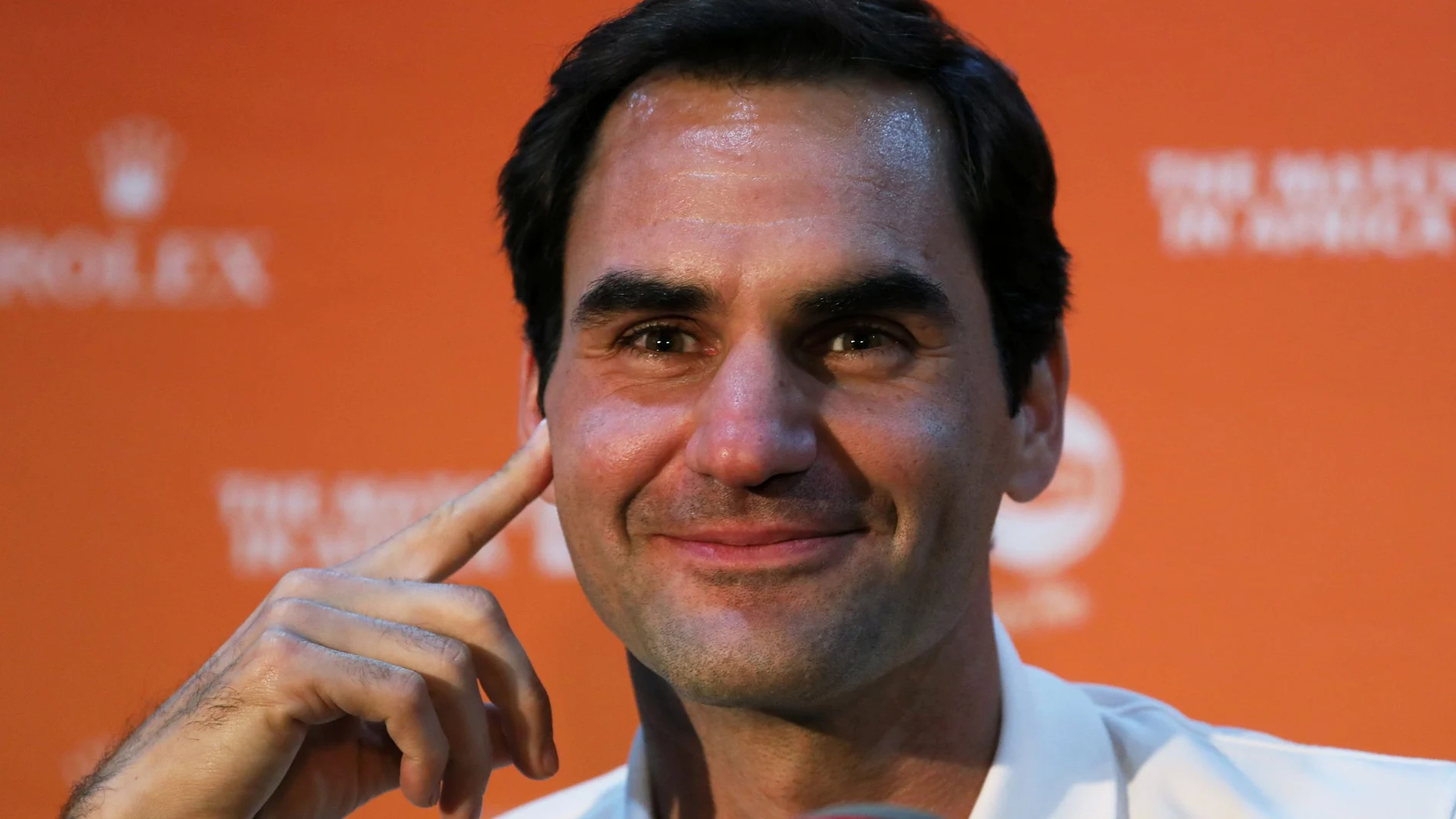 FILE PHOTO: Roger Federer speaks during a media briefing at Cape Town International Airport ahead of his exhibition tennis match against Rafael Nada