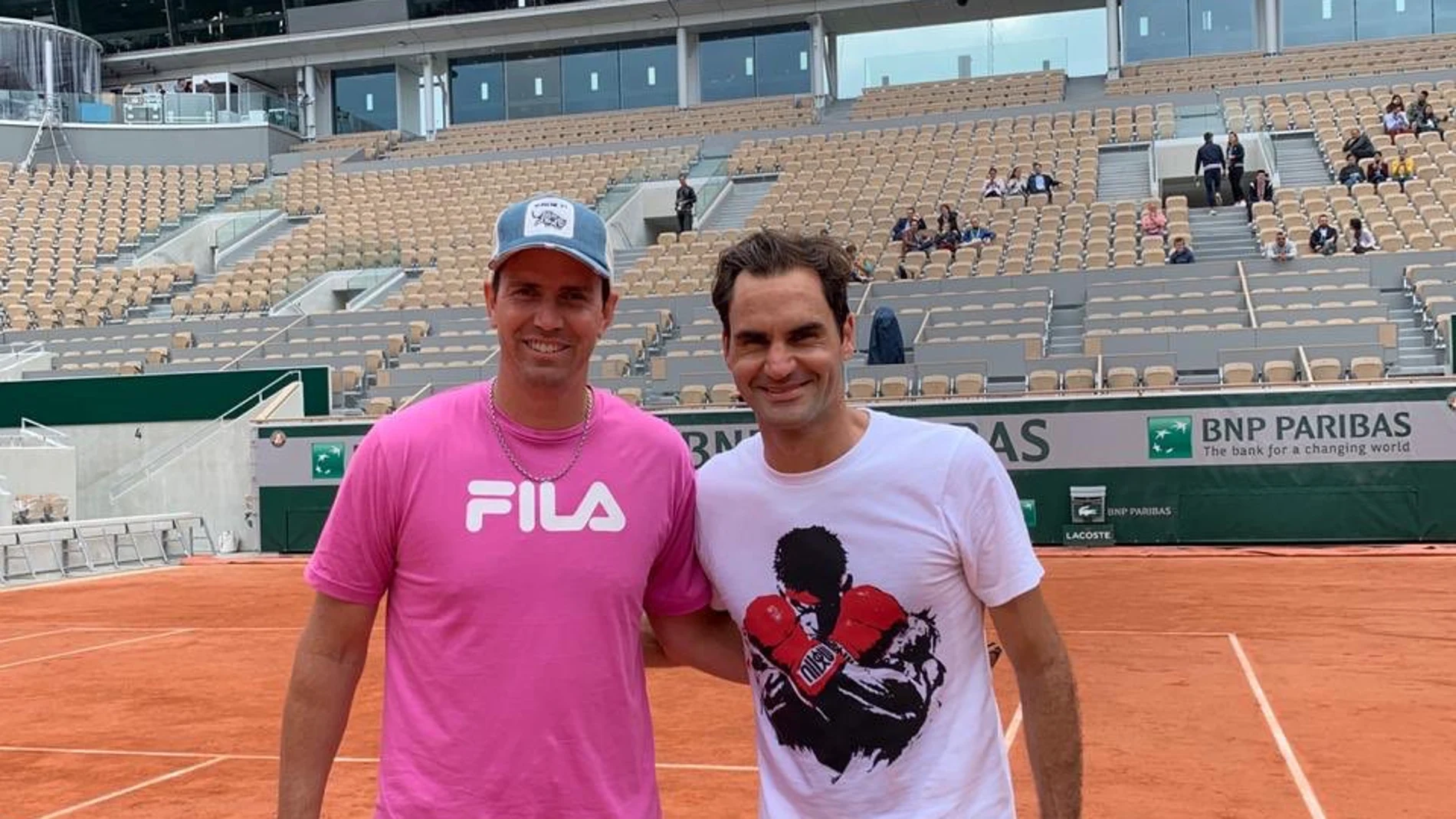 Juan Ignacio Chela con Roger Federer