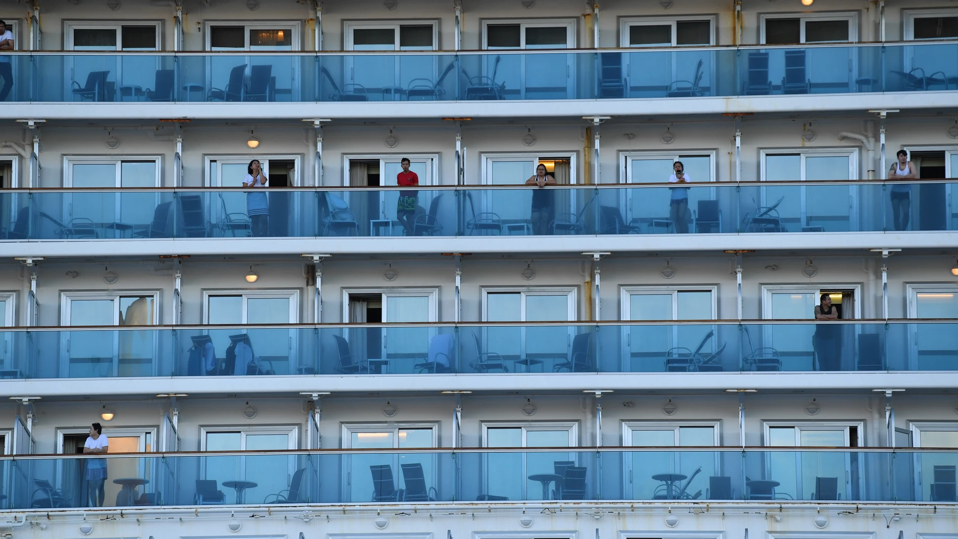 Crew on board the Ruby Princess as the cruise liner docks at Port Kembla, Wollongong, Monday, April 6, 2020. A criminal investigation will be launched into how cruise line operator Carnival Australia was allowed to disembark Ruby Princess passengers in S