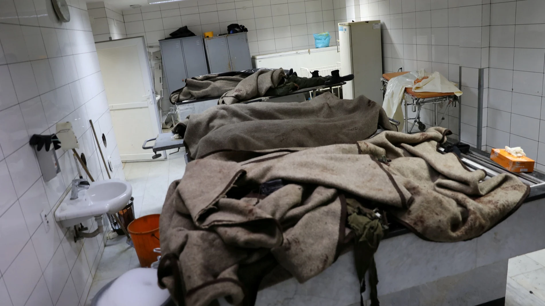 FILE PHOTO: Dead bodies are seen in a hospital following an attack on a military academy, in Tripoli