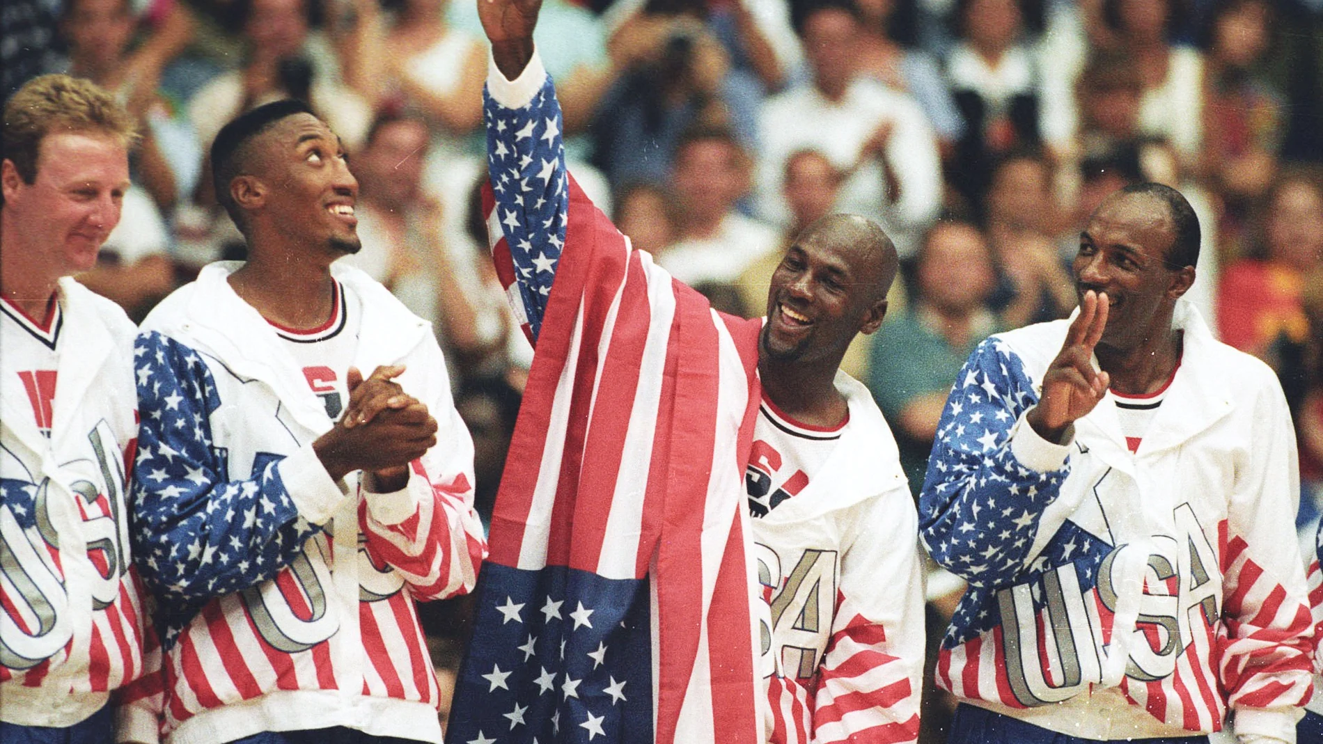 FILE PHOTO: U.S. basketball player Michael Jordan flashes a victory sign as he stands with team mates Larry Bird, Scottie Pippen and Clyde Drexler after winning the Olympic gold in Barcelona