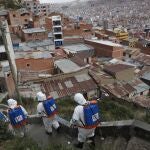 City workers disinfect a stairway in attempt to help contain the spread of the new coronavirus, in La Paz, Bolivia, Tuesday, April 28, 2020. (AP Photo/Juan Karita)