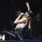 FILE - This June 30, 2019 file photo shows singer Miley Cyrus performing on the final day of Glastonbury Festival in Somerset, England. Cyrus will participate in the Class of 2020 multi-hour graduation streaming event on Facebook and Instagram on May 15. Cyrus will sing her new hit single, â€œThe Climb.â€ (Photo by Joel C Ryan/Invision/AP, File)