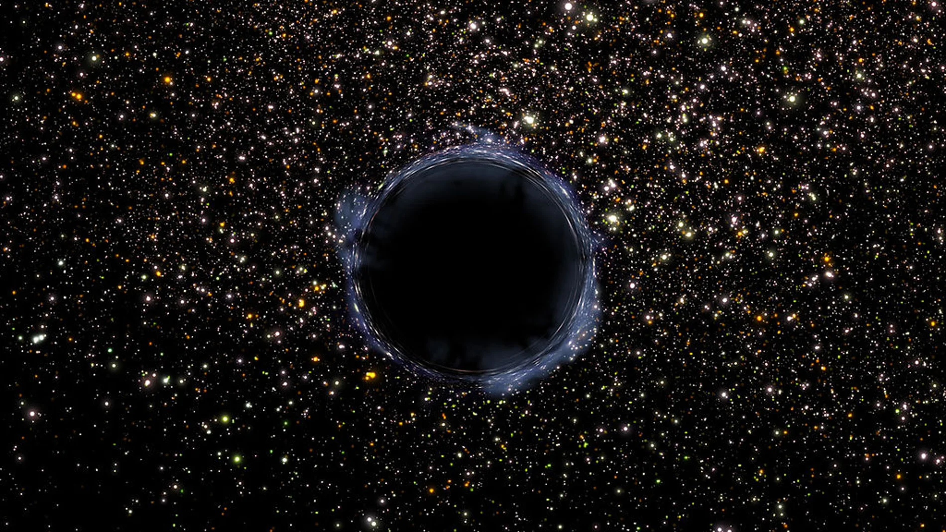 Representación de un agujero negro contra un fondo de galaxias y estrellas, en la que que vemos que el agujero negro bloquea la luz de los objetos que tiene detrás.