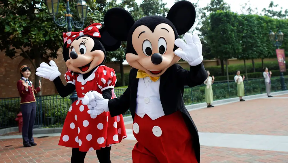 Disney characters Mickey Mouse and Minnie Mouse greet at Shanghai Disney Resort as the Shanghai Disneyland theme park reopens following a shutdown due to the coronavirus disease (COVID-19) outbreak, in Shanghai