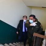 21 May 2020, Bolivia, La Paz: Bolivia's Health Minister Marcelo Navajas (L) is accompanied by a police officer after he was arrested on corruption charges related to the coronavirus (Covid 19) pandemic. Photo: -/ABI/dpa21/05/2020 ONLY FOR USE IN SPAIN