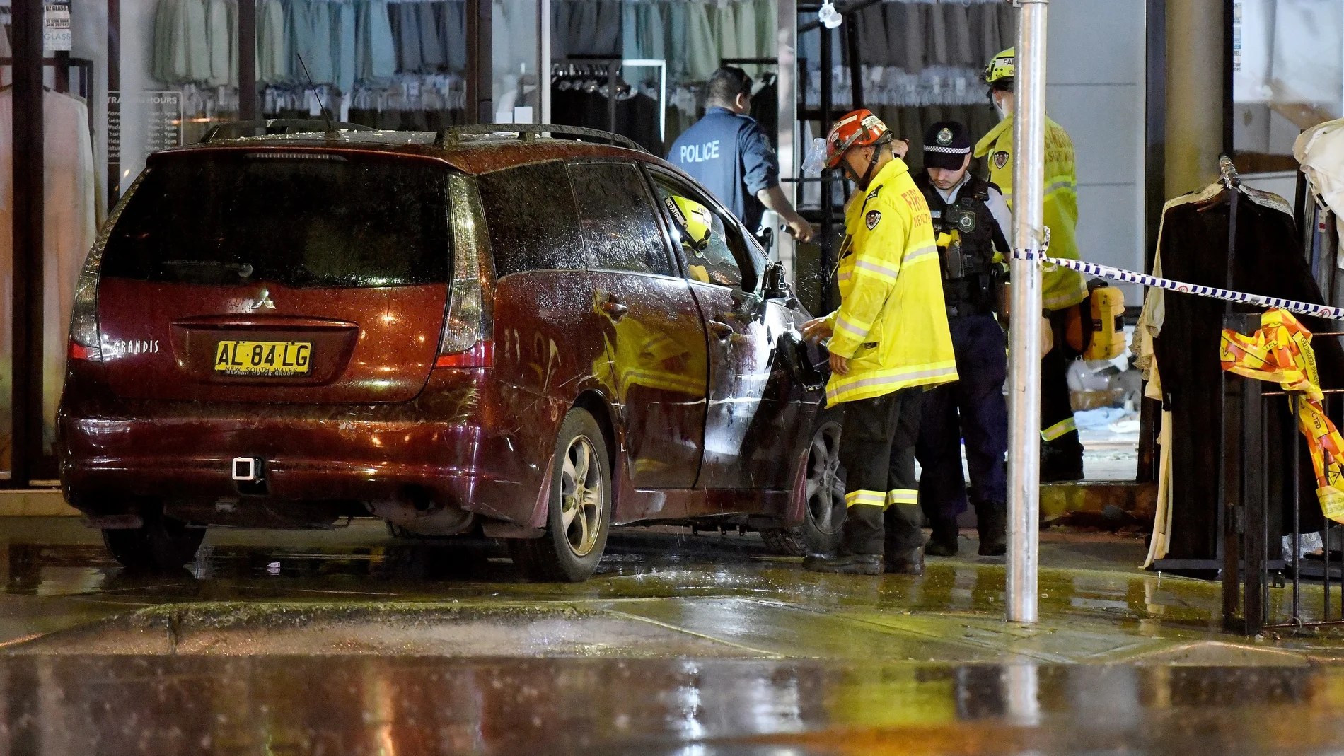 A vehicle is removed from a shop after it crashed through the front windows in Sydney
