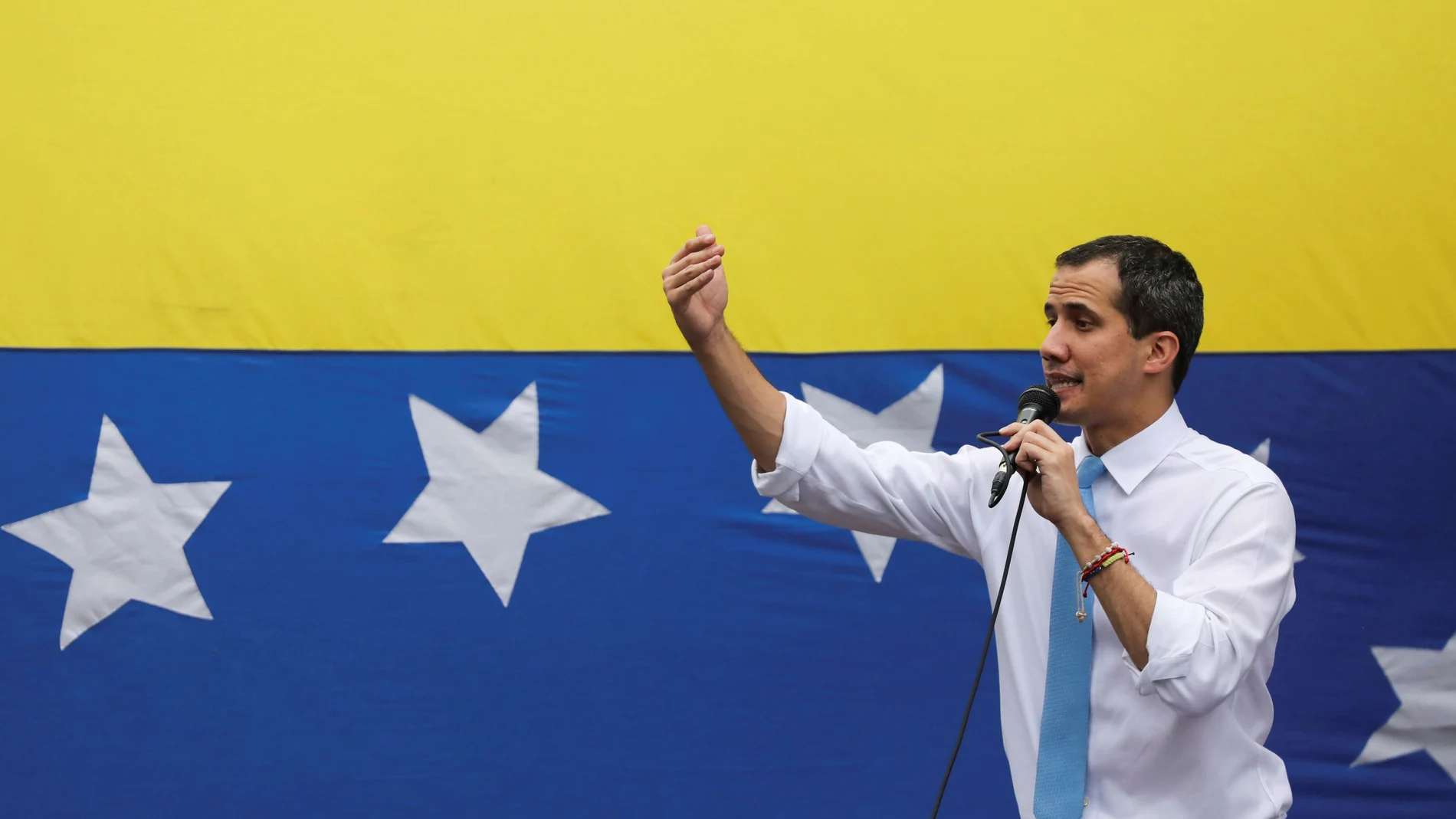 FILE PHOTO: Venezuela's National Assembly President and opposition leader Juan Guaido, who many nations have recognised as the country's rightful interim ruler, gestures as he speaks during a demonstration in Caracas