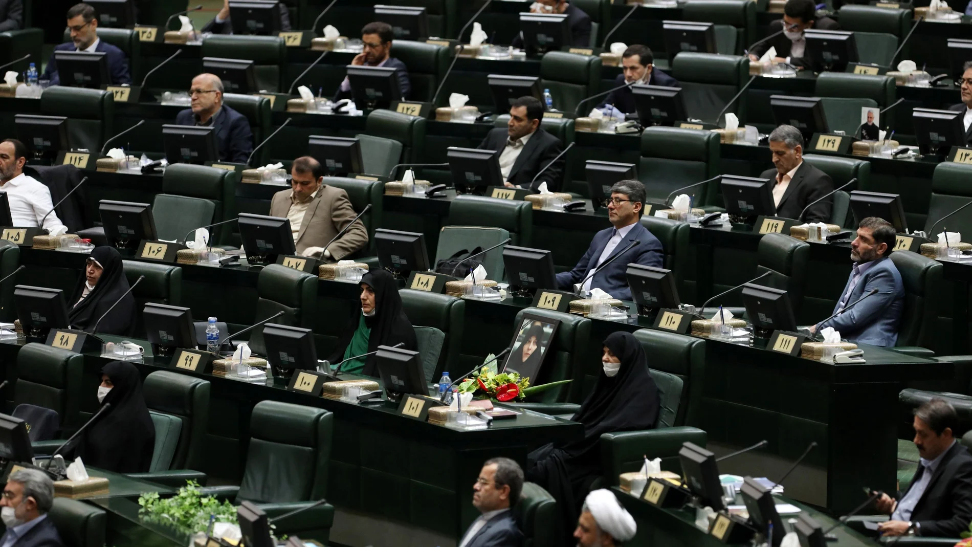 Iranian lawmakers attend the opening ceremony of Iran's 11th parliament, practicing social distancing as the spread of the coronavirus disease (COVID-19) continues, in Tehran