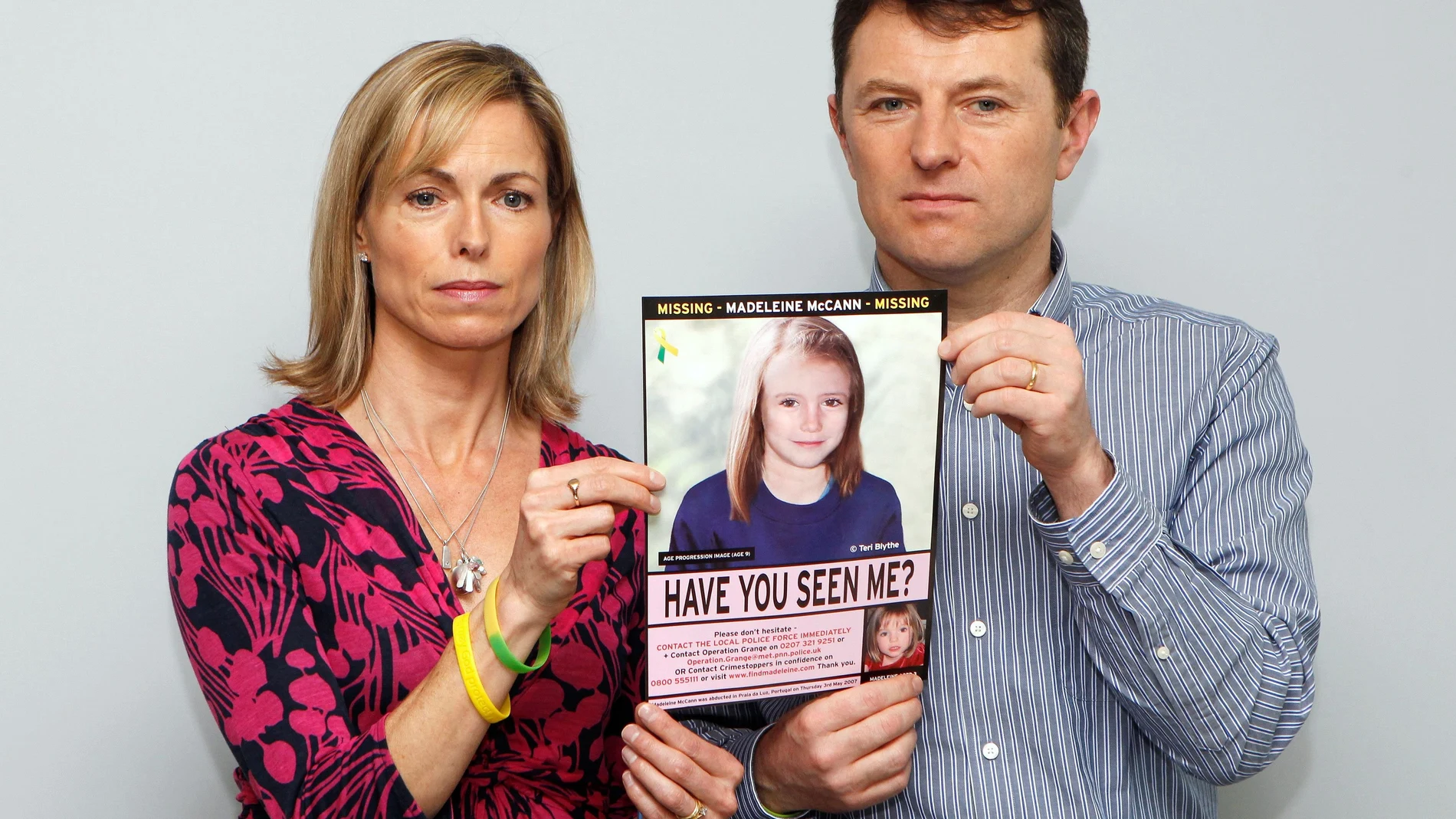 FILE PHOTO: Kate and Gerry McCann pose with a computer generated image of how their missing daughter Madeleine might look now, during a news conference in London