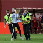 A fan with the Argentina shirt of Leo Messi jumps to the field and is taken out by the Security of the stadium during the spanish league, LaLiga, football match played between RCD Mallorca and FC Barcelona at Son Moix Stadium in the restart of the Primera Division tournament after to the coronavirus COVID19 pandemic on June 13, 2020 in Palma de Mallorca, Spain.13/06/2020 ONLY FOR USE IN SPAIN