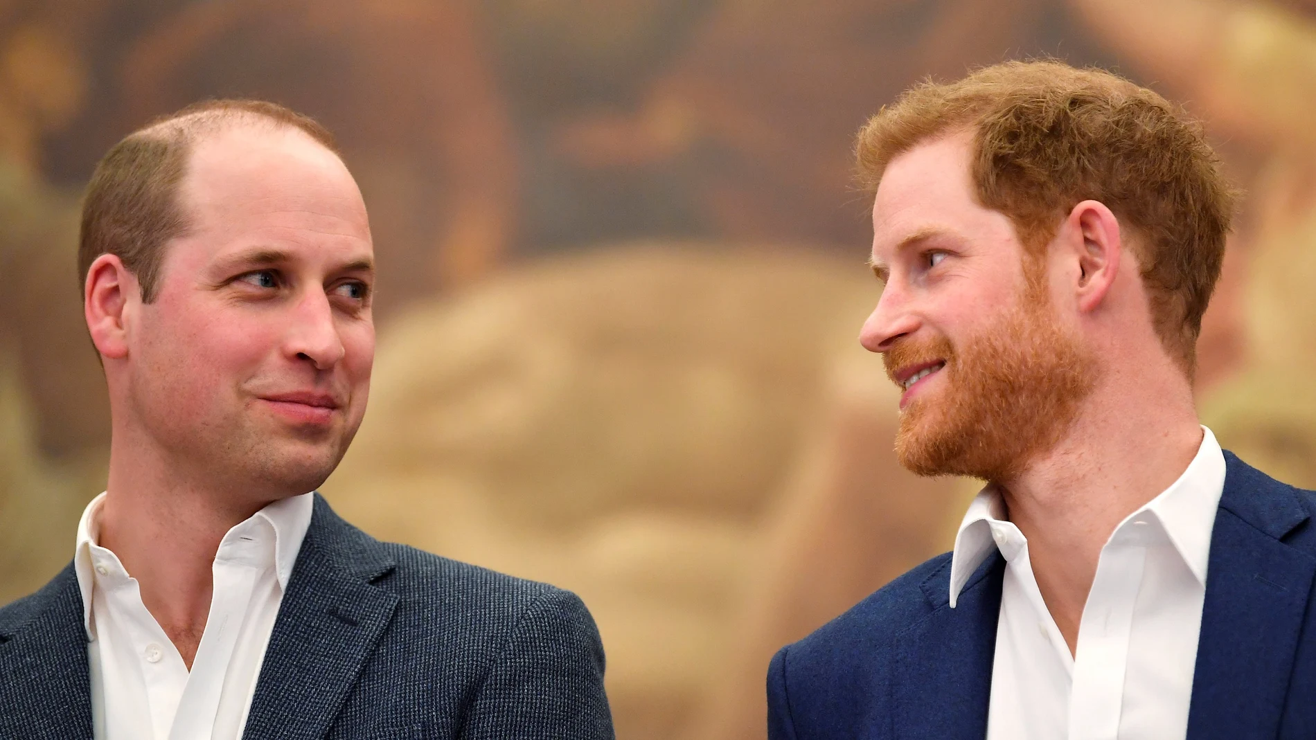 Britain's Prince William and Prince Harry attend the opening of the Greenhouse Sports Centre in central London.
