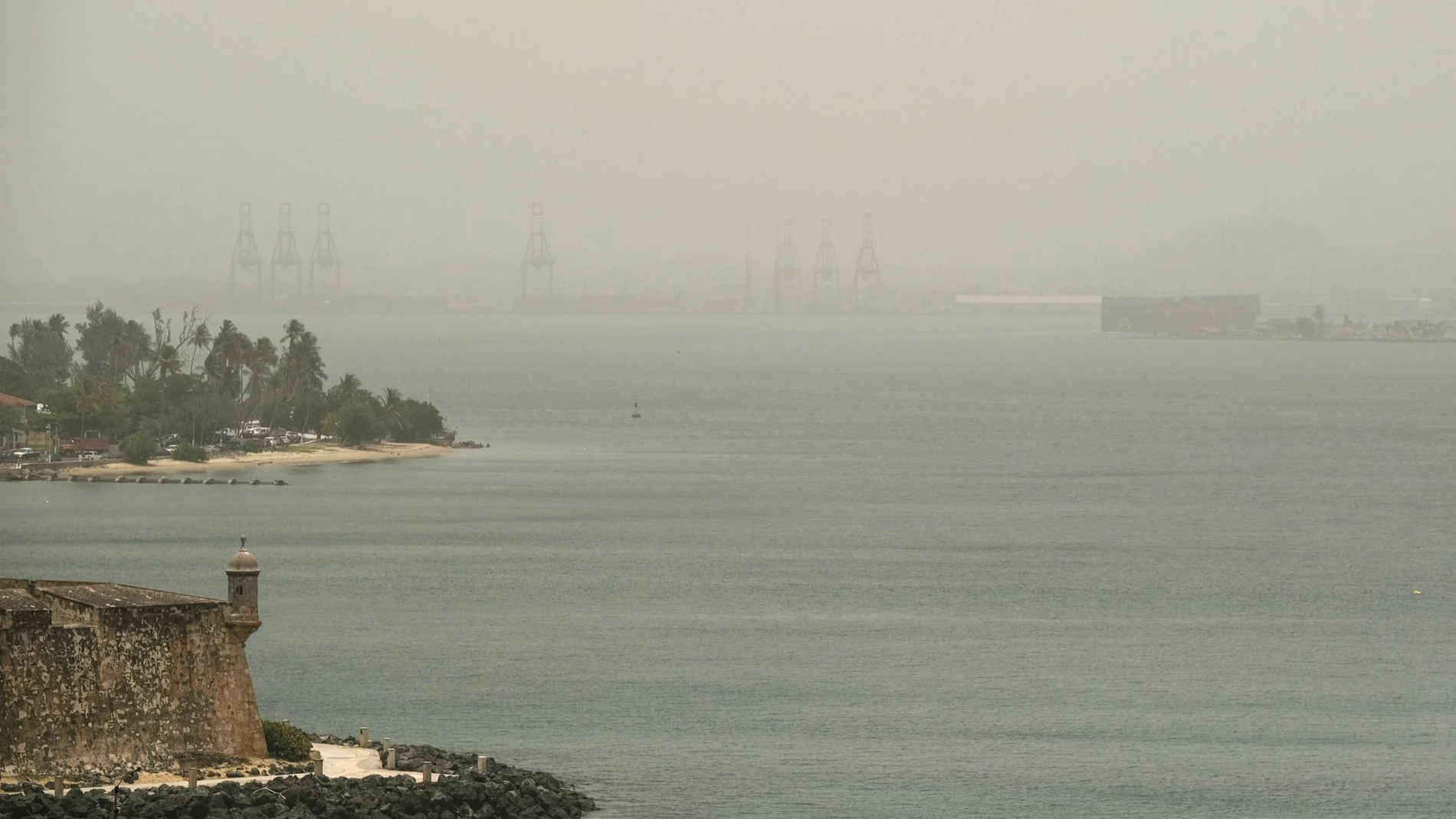 The Bay of San Juan as a sand storm from the region of the Sahara Desert sweeps over San Juan