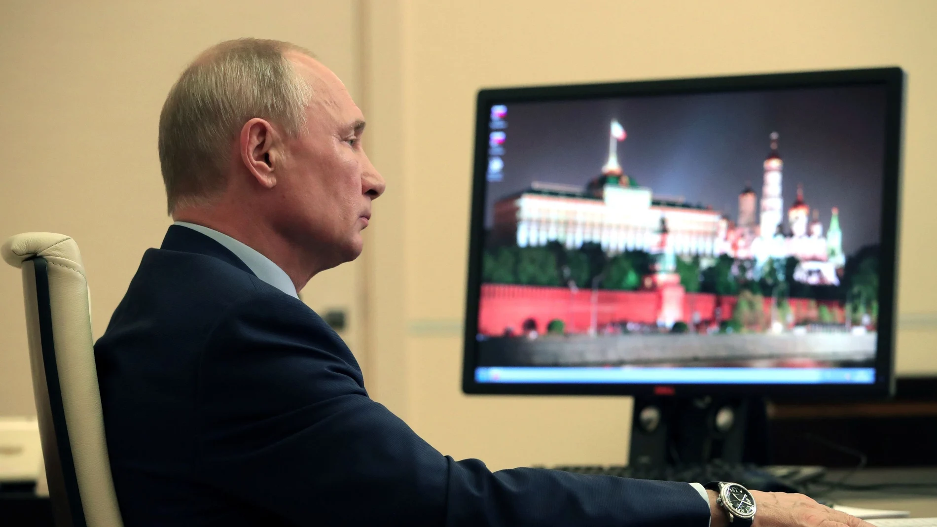 Russia's President Putin speaks with his French counterpart Emmanuel Macron during a video conference call outside Moscow