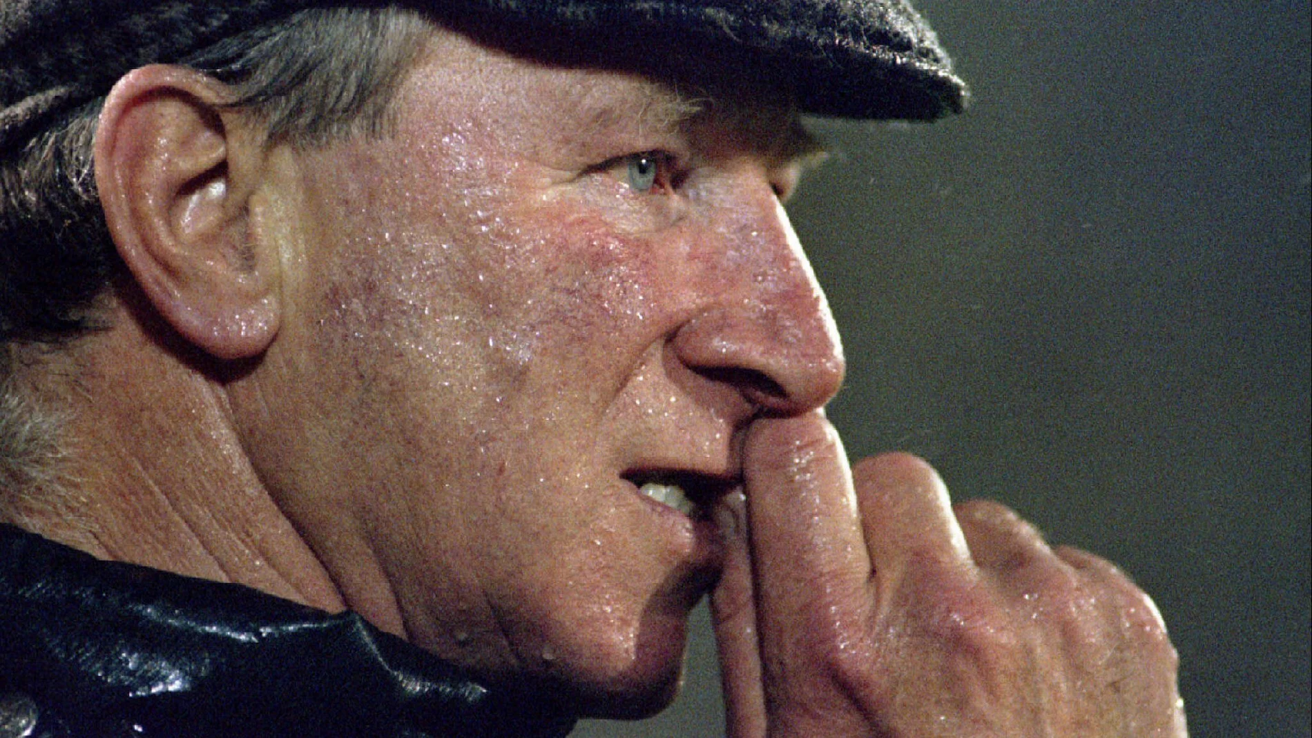 FILE PHOTO: Ireland's British coach Jack Charlton bites his nails during the last minutes of an European Championship Group Six qualifying match against Portugal at Lisbon's Light stadium, in Lisbon