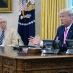President Donald Trump meets with Senate Majority Leader Mitch McConnell, shown left, and House Minority Leader Kevin McCarthy, not shown, in the Oval Office at the White House, Monday, July 20, 2020, in Washington. (AP Photo/Evan Vucci)