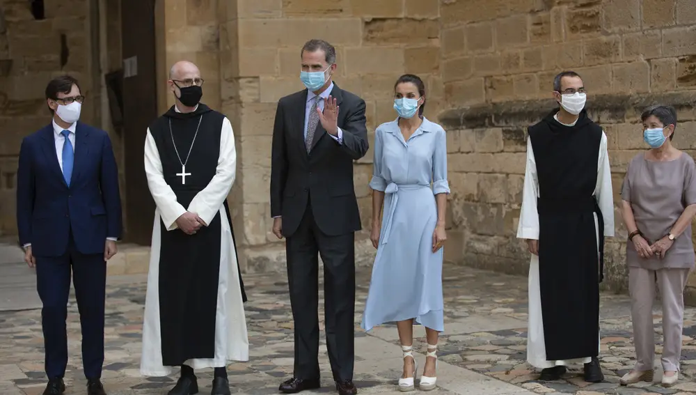 Spain's Health Minister Salvador Illa, left, Spain's King Felipe VI, third left, and Queen Letizia, third right, visit the Royal Monastery of Poblet, northeastern Spain, Monday, July 20, 2020. Hundreds of Catalan independence supporters are protesting Monday the visit of King Felipe VI and Queen Letizia to the northeastern region as part of a royal tour across Spain that is meant to bolster spirits amid the coronavirus pandemic. The visit comes as a barrage of media leaks have revealed how the king's father, former monarch Juan Carlos I, allegedly hid millions of untaxed euros in offshore funds. (David Zorrakino/Europa Press via AP)