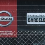 FILE PHOTO: The logo of Nissan is seen through a fence at Nissan factory at Zona Franca in Barcelona, Spain, May 26, 2020. REUTERS/Albert Gea/File Photo