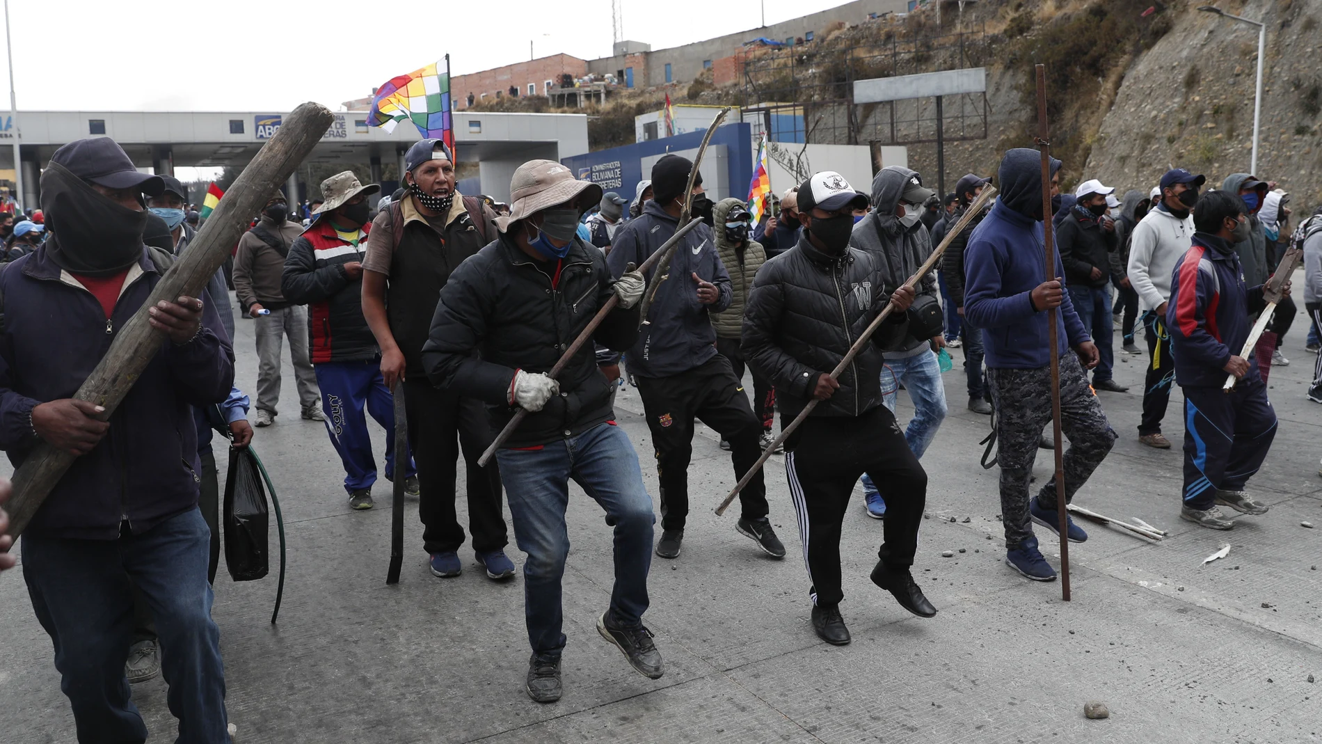 Demonstrators form up during a protest against the postponement of the presidential election, in El Alto, Bolivia, Tuesday, Aug. 11, 2020. Citing the ongoing new coronavirus pandemic, Bolivia's highest electoral authority delayed presidential elections from Sept. 6 to Oct. 18, the third time the vote has been delayed. (AP Photo/Juan Karita)