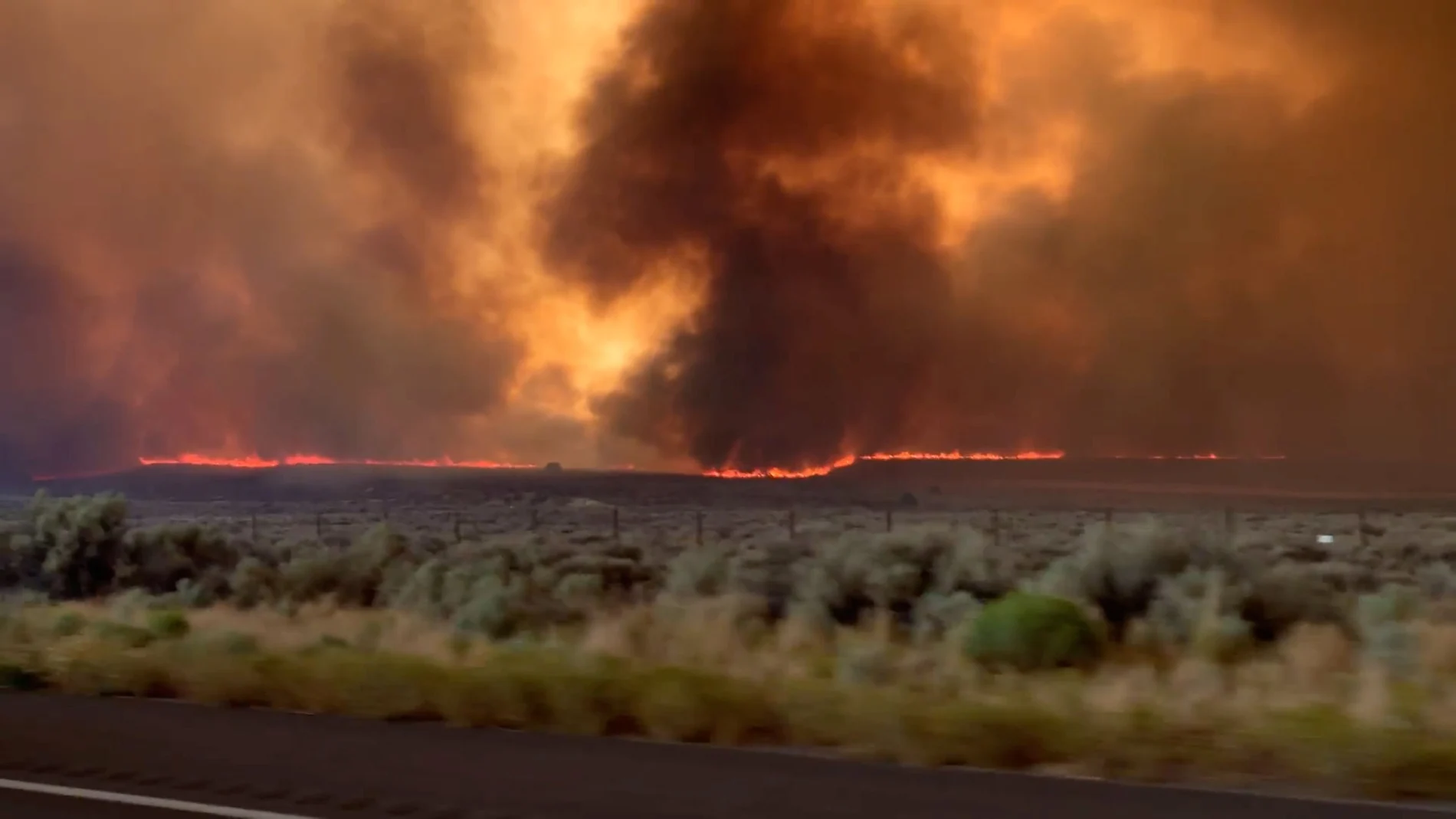 Fire and smoke from the Loyalton Fire is seen from a highway in Lassen County, California, U.S., August 15, 2020 in this screen grab obtained from a social media video. Dylyn Walker/via REUTERS THIS IMAGE HAS BEEN SUPPLIED BY A THIRD PARTY. MANDATORY CREDIT. NO RESALES. NO ARCHIVES.